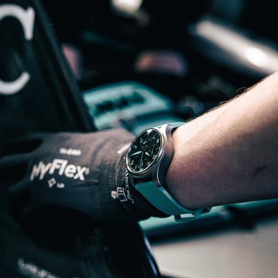 Person wearing a smartwatch with a blurred background